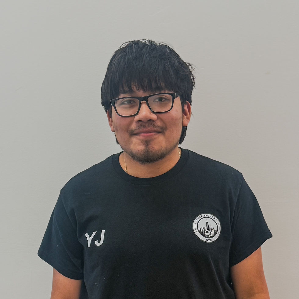 Young man in glasses wearing black t-shirt with FreeKickersNYC logo