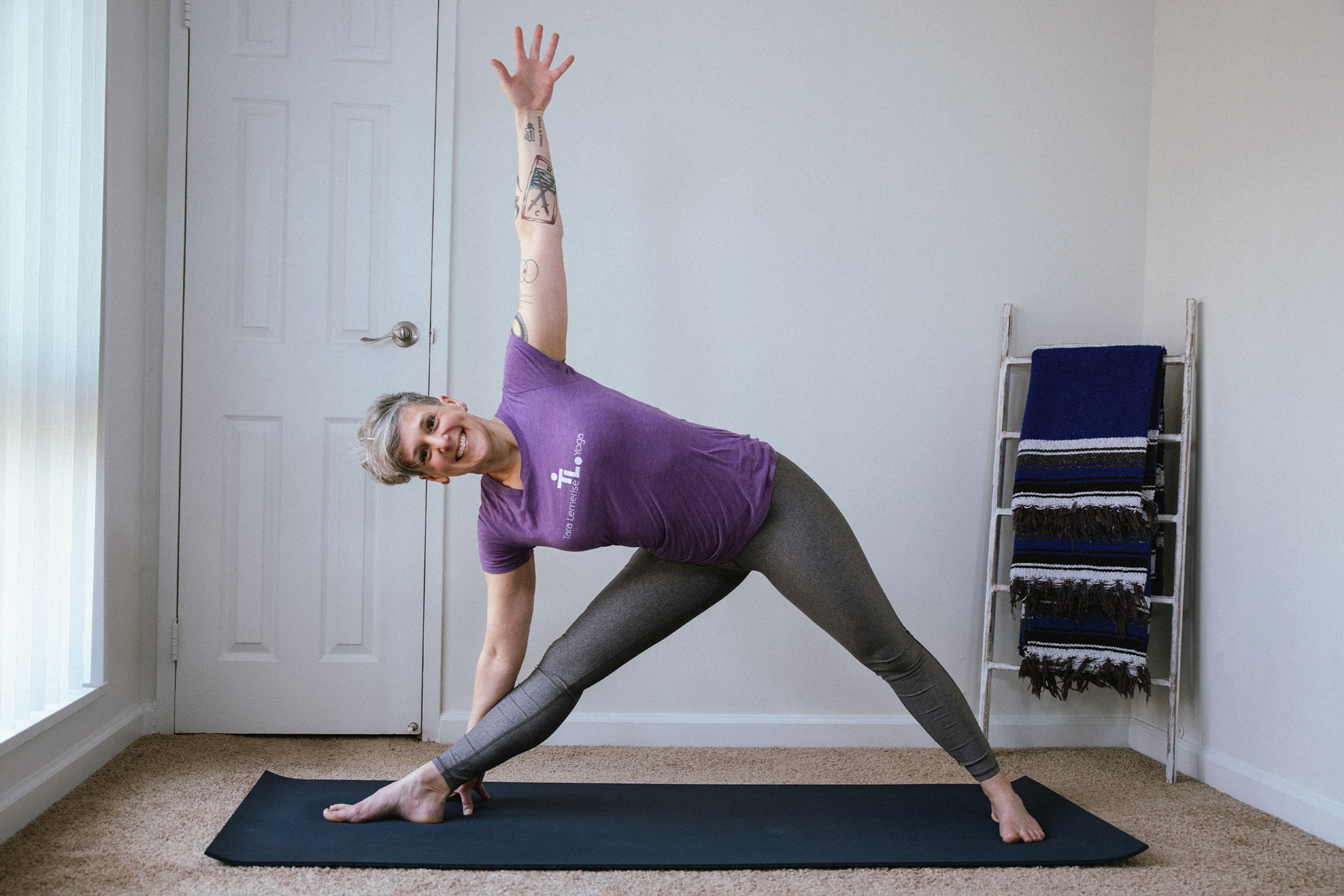 Tara in triangle pose