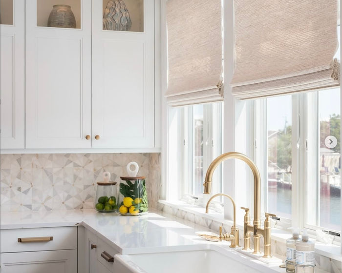 Woven wood shades over a kitchen sink