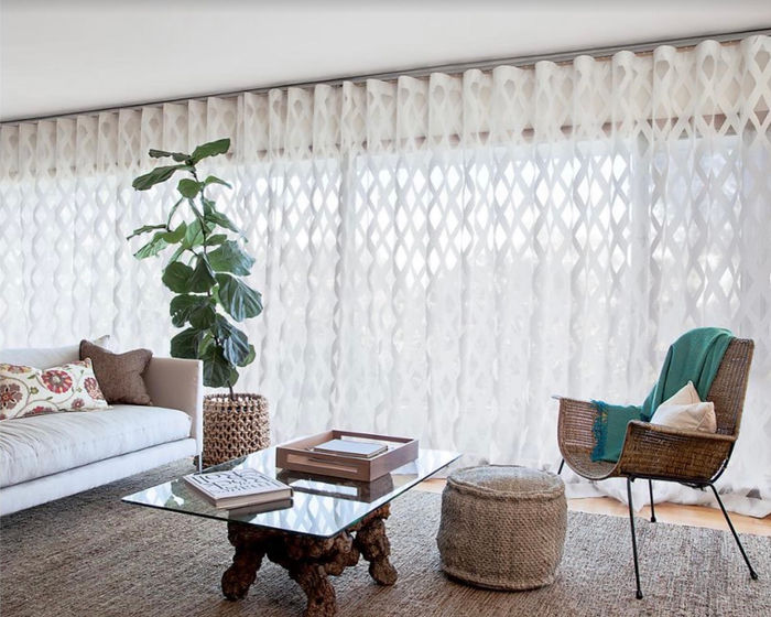 Patterned sheer drapery in a sitting room
