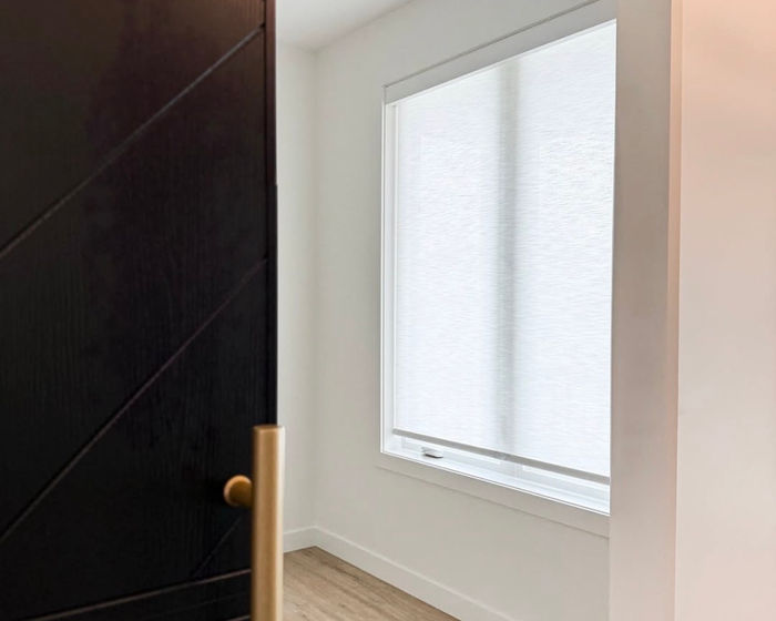 Roller shade in a bedroom