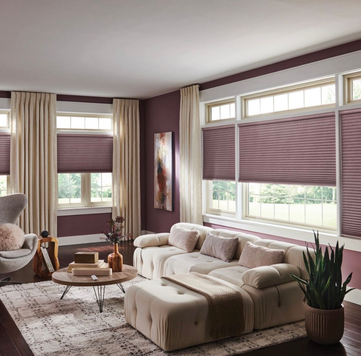 Top-down/bottom-up cellular shades with drapery in a living room