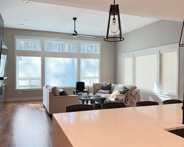 Roller shades in an open living and kitchen space
