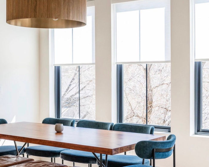 Light-filtering roller shades in a dining room