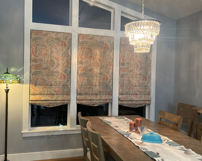 Paisley Roman shades in a dining room