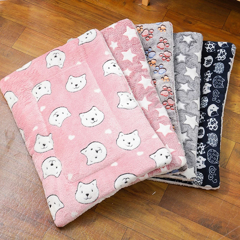 Flannel cat sleeping mats in various patterns and colors.