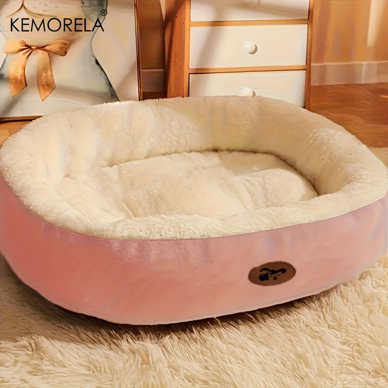 Thumbnail: Plush pink oval snuggle pet bed with soft white lining