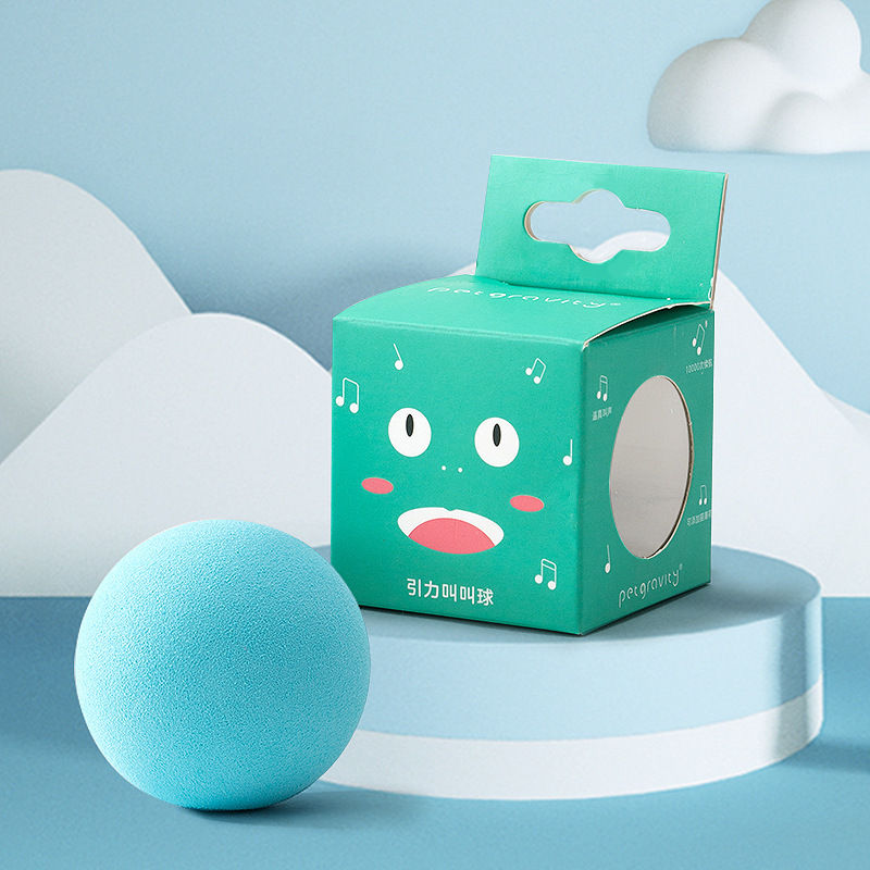 Thumbnail: Blue EVA foam cat toy ball next to its green packaging
