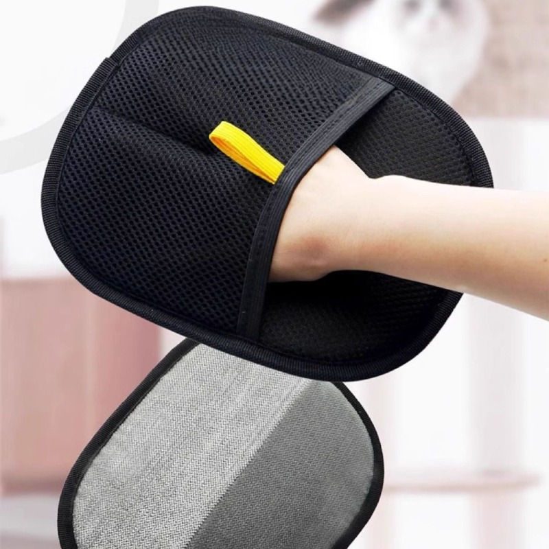 Thumbnail: Hand wearing black reusable pet fur remover glove