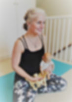 Alison Fiddler holding doll and pelvis for hypnobirthing
