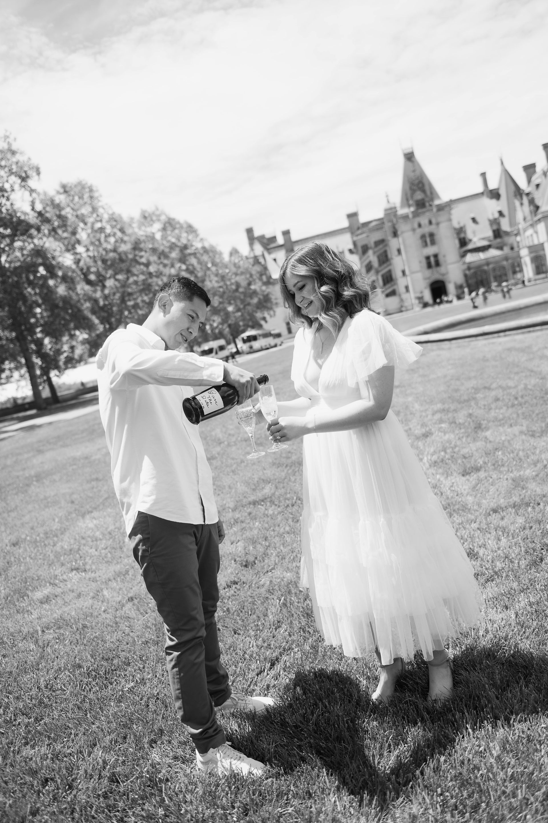 champagne toast at an engagement photoshoot