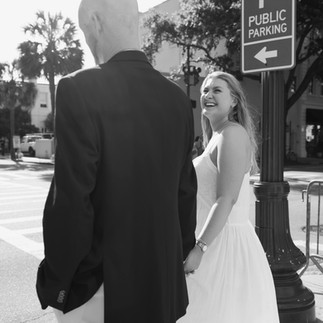 candid couple crossing the street