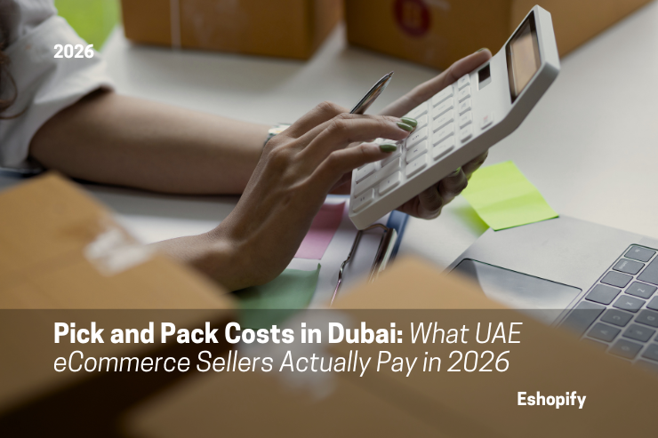 Hands using a calculator next to a laptop, surrounded by boxes. Text: Pick and Pack Costs in Dubai: What UAE eCommerce Sellers Actually Pay in 2026.
