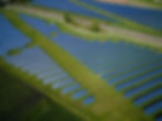 Aerial view of vast solar farm generating clean energy