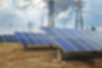 Solar panels in a field near power lines
