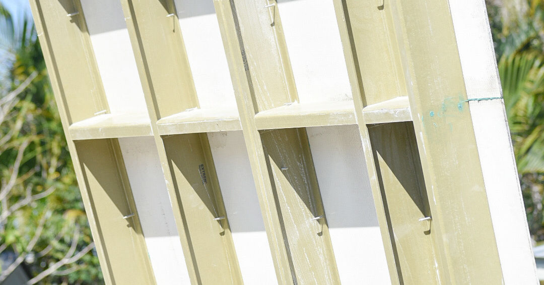 Close-up view of a building structure's internal framework with white panels.