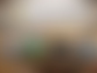 Digital weighing machines on a counter in a produce market. Logo "Accurate Optimism" with a smiling face is visible. Bags of potatoes nearby.