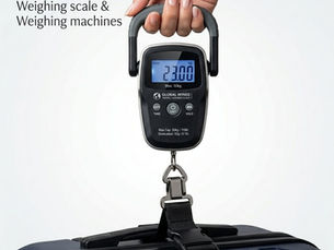 A hand holds a black luggage scale weighing a blue suitcase at 23 kg. Text reads "Accurate Optimism" and mentions warranty details.