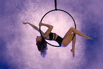 a woman on an aerial hoop
