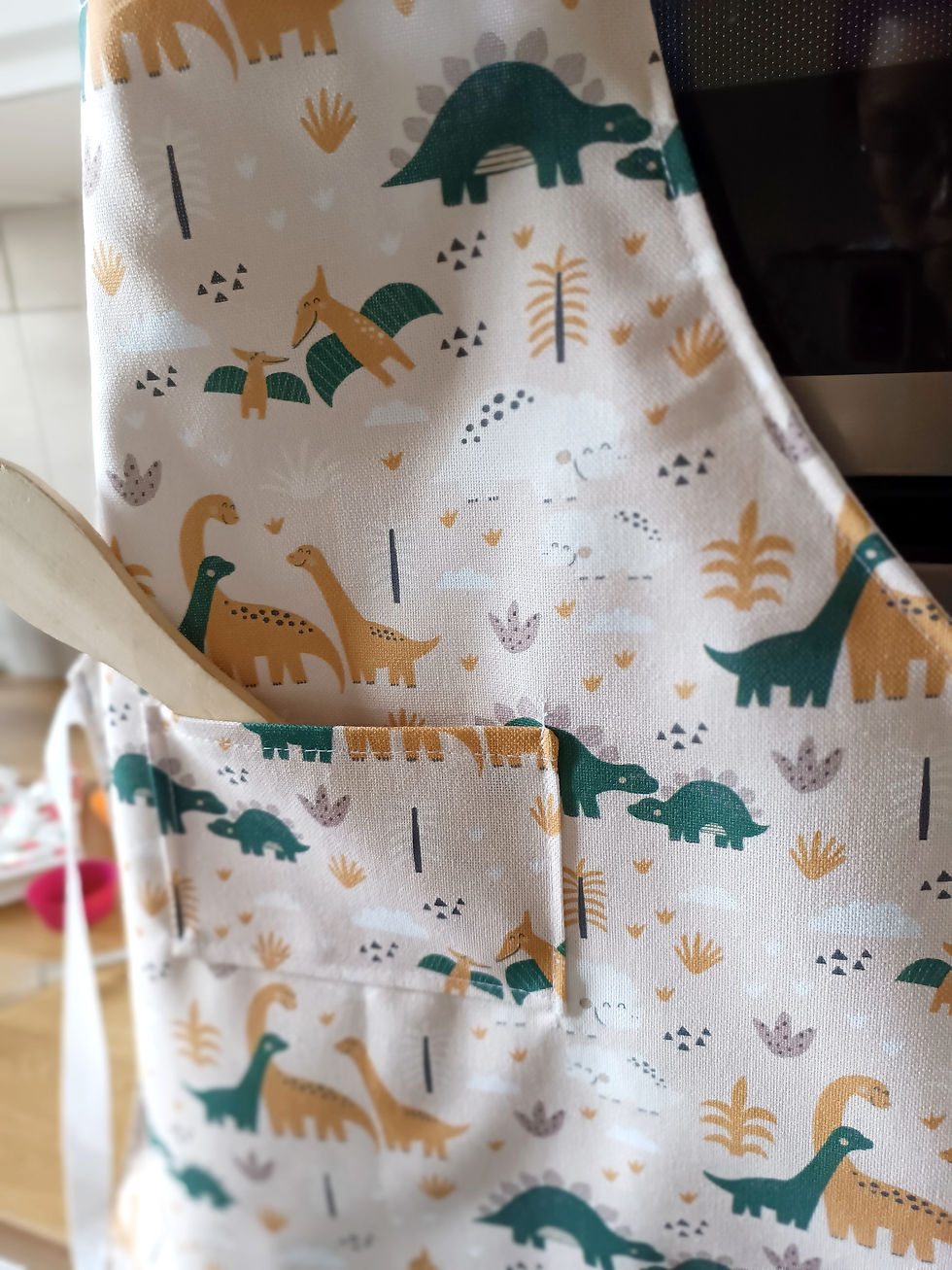 Miniature : Tablier enfant dinosaures personnalisé avec poche devant