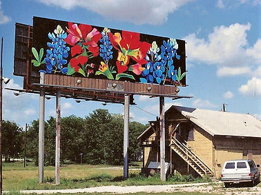 Texas Wildflower billboard painted by Lynne Looney featuring bluebonnets and colorful wildflowers.