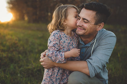 dad holding daughter