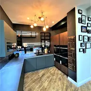 Large white traditional kitchen with island and marble worktops