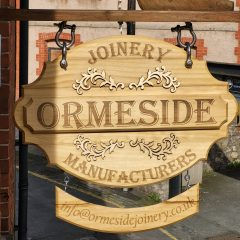 Hanging carved wooden sign for Ormeside Joinery