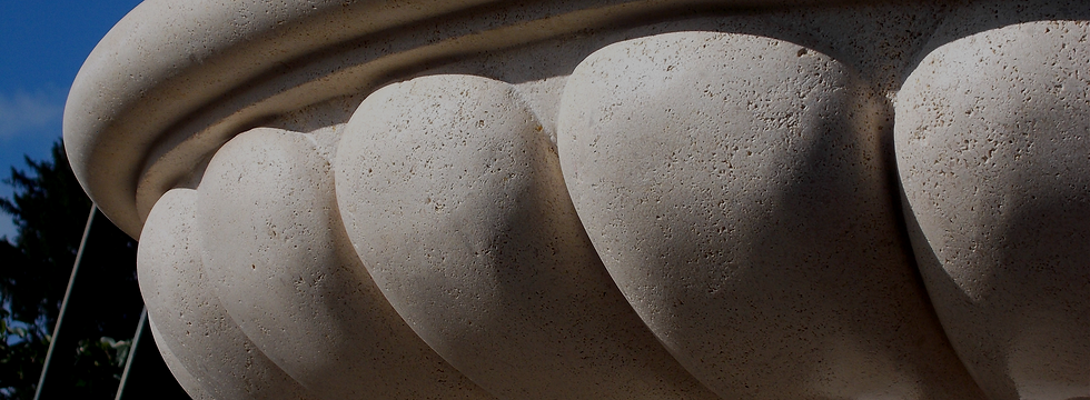 A textured stone fountain edge with rounded