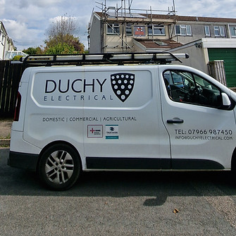 White van with "Duchy Electrical" logo and contact info parked on a street
