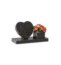Black granite heart memorial featuring a matching square flower vase with bright yellow and red blooms