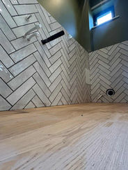 Close-up of newly installed floor tiles in a bathroom renovation