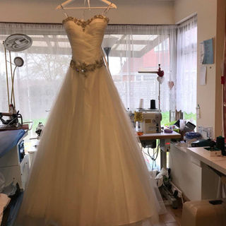 A white wedding dress with a beaded bodice