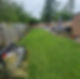 Long backyard with a lawn and a patio area