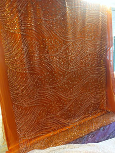 Orange shimmer net fabric