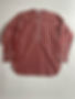 A folded red and white striped shirt