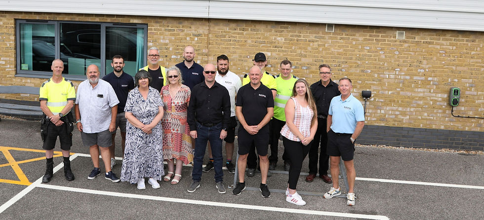 Buxtons team members standing together outside building