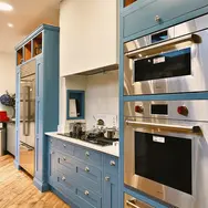 Built-in double ovens integrated into modern kitchen cabinetry