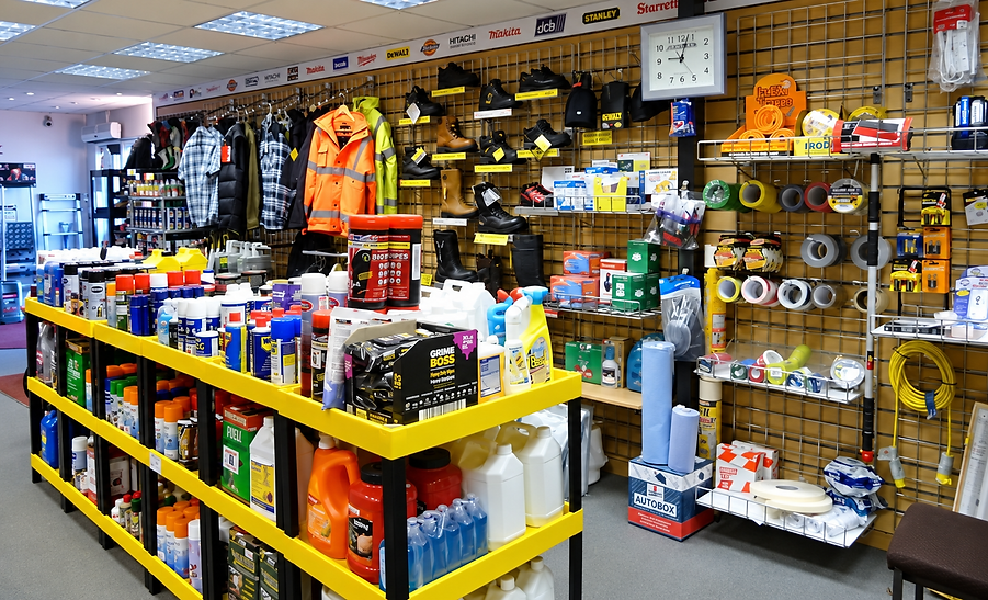 Interior layout of hardware store showing shelving units with hi-vis workwear and supplies