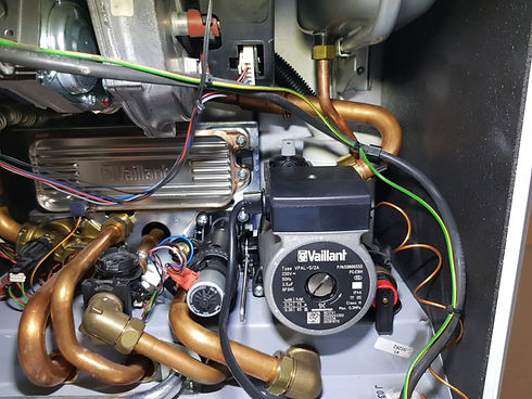 Boiler internal view, pipes, wires, and Vaillant pump