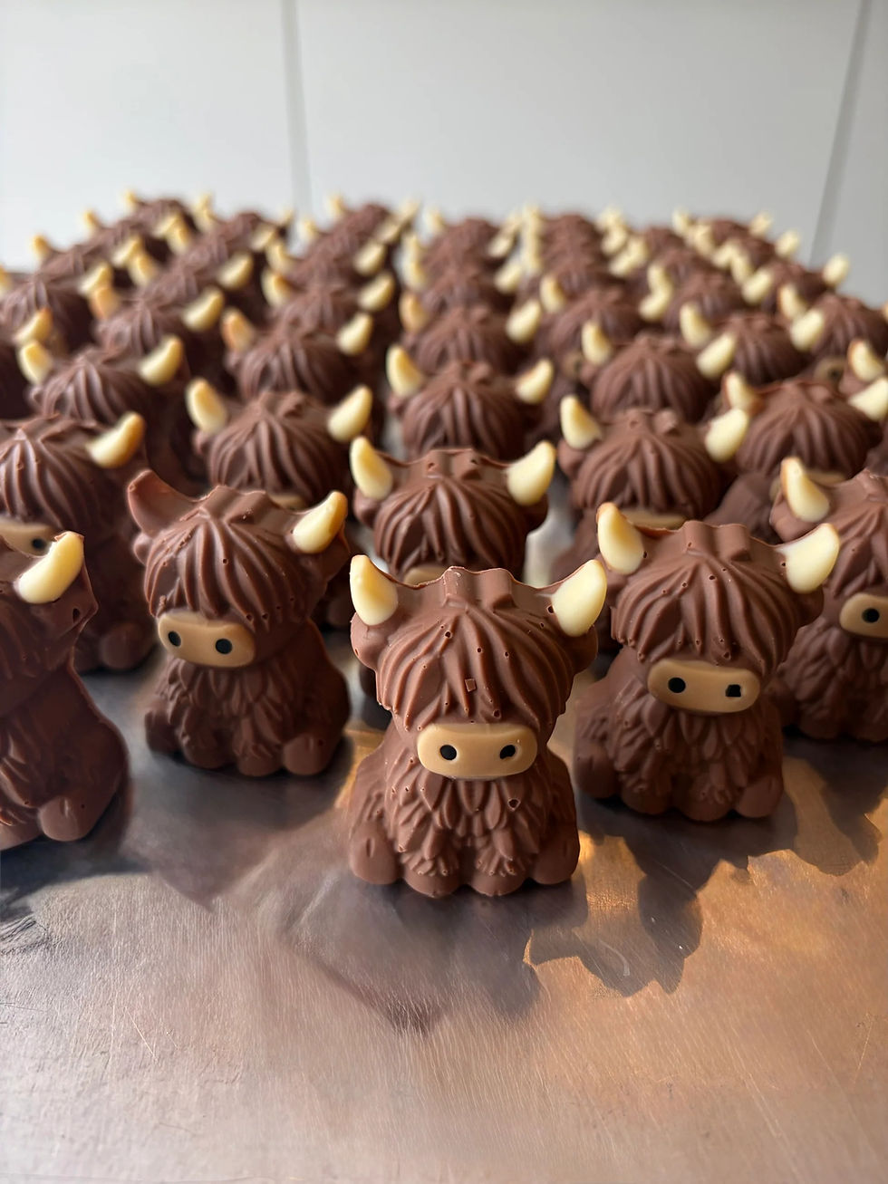 Hand-moulded milk chocolate Highland cows