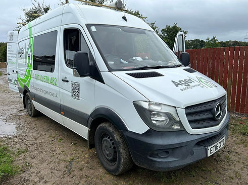 A white van with a company logo Agel Building Services