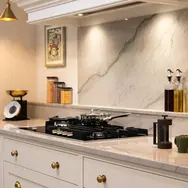 Modern blue kitchen showroom interior with warm lighting