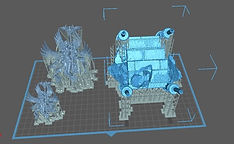 3D slicing software interface displaying supported resin models of a winged figure and stone terrain