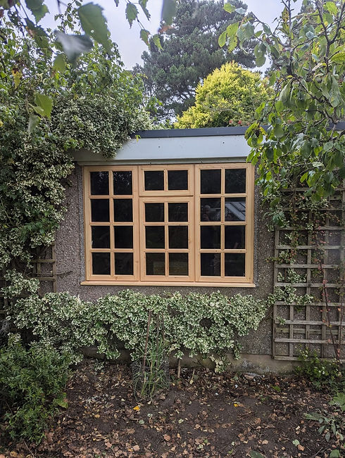 Timber casement window installed on a stone exterior wall