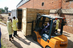 26 loading crates into container