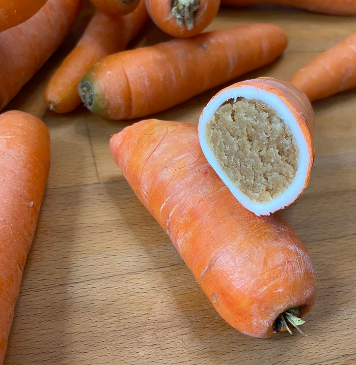 hyperrealistic carrot illusion cake by Dorset cake artist