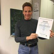 Dr King inventor investor holding one of his patents