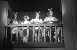 Four actresses on balcony, theatrical production