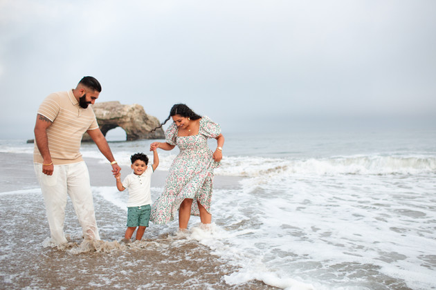 hkcreate bay area photography joyful candid light and airy san jose photographers northern california photoshoot
family playing at the beach putting feet in the ocean at natural bridges state beach santa cruz family of three
